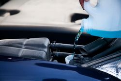 Auto repair service refilling fluids