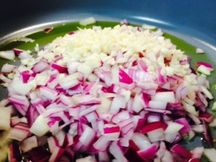 Red onion and garlic in extra virgin olive oil.  This sauce is a great way to get kids to eat onion and garlic since the almond milk and flour mask their strong flavors. 